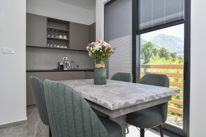 Family Apartment, Sea View | Private kitchen | Mini-fridge, oven, stovetop, dishwasher