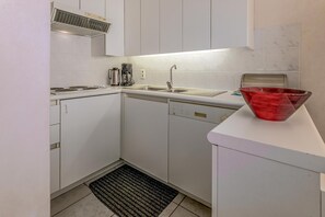 Fridge, coffee/tea maker, cookware/dishes/utensils