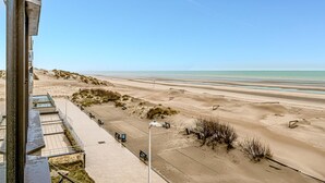 A beach view from a building with a clear sky. - 1 bedroom accommodation in Sint Idesbald (Sint Idesbald)