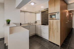 Fridge, coffee/tea maker, cookware/dishes/utensils