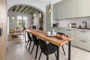 Microwave, oven, coffee/tea maker, dining tables