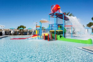 A water park with a pool, slides, and a water play area. - Upstay - 20 Guest Mansion w THE Best Amenities (Kissimmee)