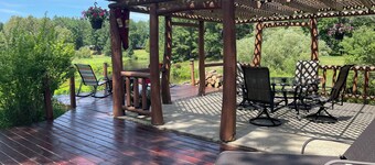 Ausable River waterfront 4-bed house in Grayling w/dock, patio, firepit, garage.