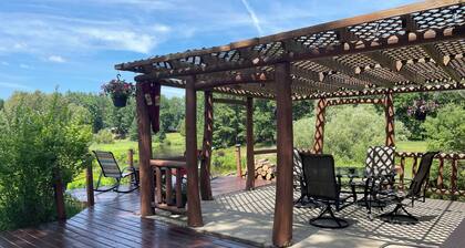 Ausable River waterfront 4-bed house in Grayling w/dock, patio, firepit, garage.