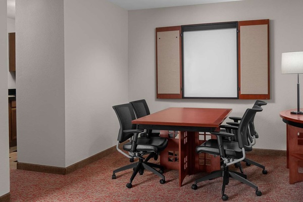 Get work done comfortably at the roomy in-suite workspace.
