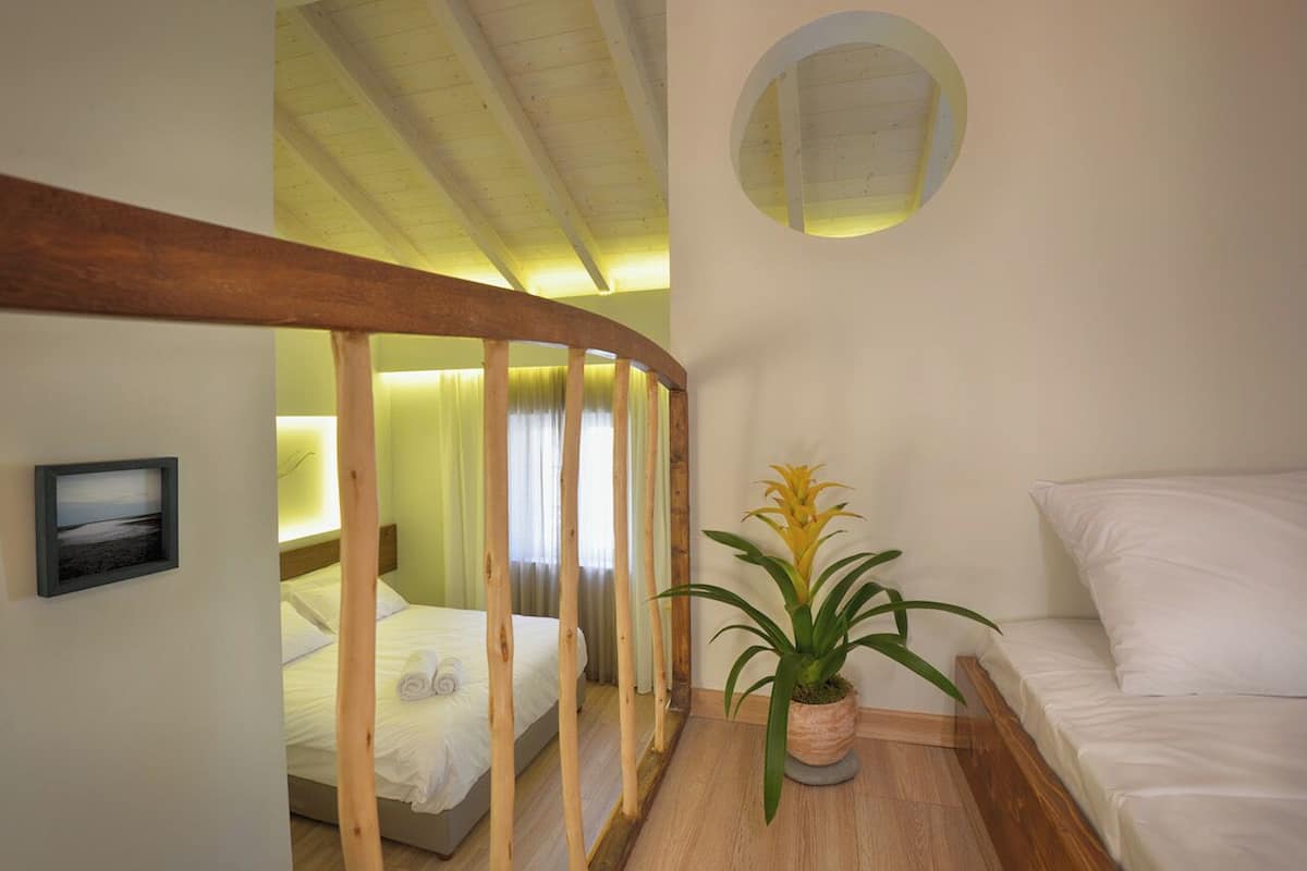 Deluxe Quadruple Room | In-room safe, desk, blackout drapes, soundproofing