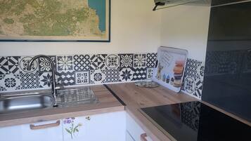 Fridge, microwave, stovetop, coffee/tea maker