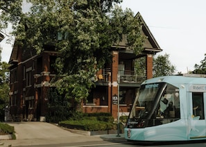 A light blue transit bus with the number 813 and the text 'RideKC' on the front.