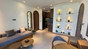 Superior Suite, Balcony, Garden View | Living area | 65-inch Smart TV with digital channels