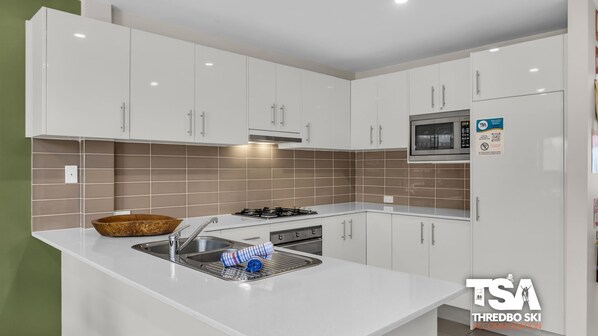 Oven, stovetop, dishwasher, coffee/tea maker