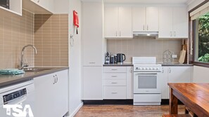 Coffee/tea maker, cookware/dishes/utensils, dining tables