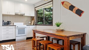 Coffee/tea maker, cookware/dishes/utensils, dining tables