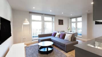 Appartement Deluxe | Coin séjour | Télévision à écran plat