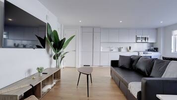 Apartment | Living area | 40-inch Smart TV with cable channels