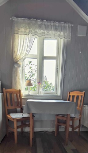 Island house room Shared entrance with hosts Two single beds + sofa bed Small kitchen