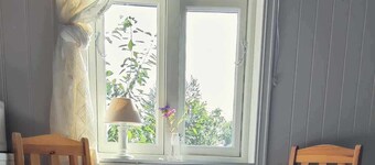 Island house room Shared entrance with hosts Two single beds + sofa bed Small kitchen