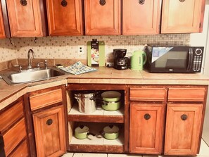 Fridge, microwave, stovetop, coffee/tea maker