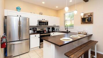 Townhome, Multiple Beds, Hot Tub, Garden View (Ohana Villa at Regal Palms) | Private kitchen | Fridge, microwave, oven, stovetop