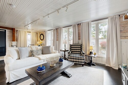 Historic 2 bedroom home with wood-burning fireplace and river front views