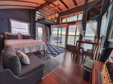 2 bedrooms, WiFi, bed sheets. The Burrow, an amazing floating cabin with pontoon rental available
