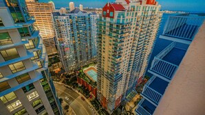 A high-rise building with multiple balconies and a rooftop pool. - The Club 3904 · High Floor Unit Located in Brickell - Free Parking (Miami)