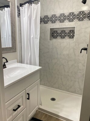 Shower, towels, soap, toilet paper