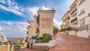 A building with a sign reading "RESTAURANTE Torre Velilla Pueblo Andaluza". - 2 bedroom cozy apartment in Almunecar (Almunecar)