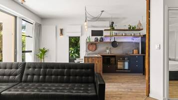 Apartment, 2 Bedrooms | Living area | 55-inch flat-screen TV with digital channels, TV