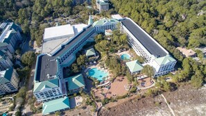 A large hotel complex with multiple buildings, a central courtyard, and a swimming pool. - HHI Villa with WestinResort amenities, PLUS golf tennis pickleball included (Hilton Head Island)