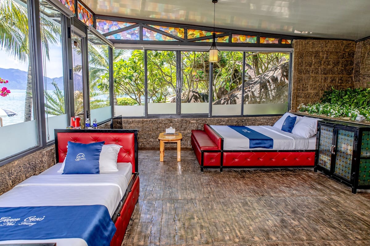 Bungalow, uitzicht op zee | Luxe beddengoed, een minibar, een kluis op de kamer