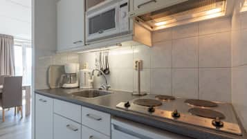 Comfort Apartment, 1 Bedroom | Private kitchen | Fridge, microwave, dishwasher, coffee/tea maker