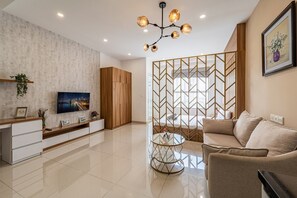 Superior Apartment, 1 Bedroom, City View | Living area | 35-inch TV with cable channels - Sunrise City - Lotte Mart District 7 (Ho Chi Minh City)