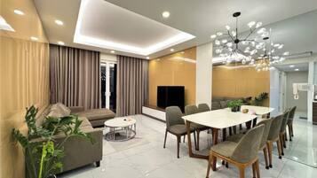 Superior Apartment, 3 Bedrooms, Kitchen, City View | Living area | 35-inch TV with cable channels