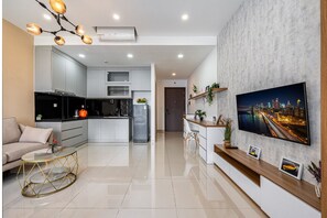 Superior Apartment, 1 Bedroom, City View | Living area | 35-inch TV with cable channels - Sunrise City - Lotte Mart District 7 (Ho Chi Minh City)