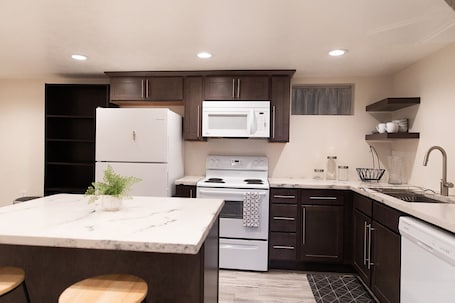 Fridge, microwave, oven, stovetop. Charming 2-bedroom basement apartment in Ogden!