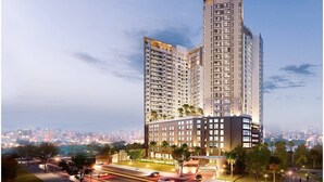 A high-rise residential building with multiple balconies, a well-lit entrance, and a view of the cityscape in the background. - The Everich Infinity - China Town Apartment (Ho Chi Minh City)