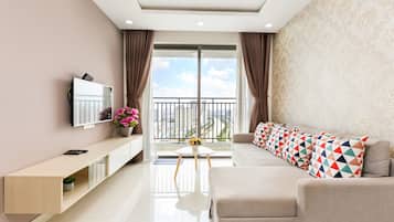 Superior Apartment, 3 Bedrooms, Kitchen, City View | Living area | 35-inch TV with cable channels