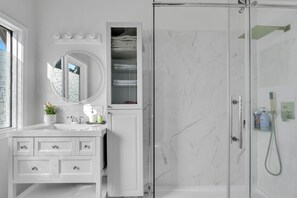 Shower, hair dryer, towels, soap