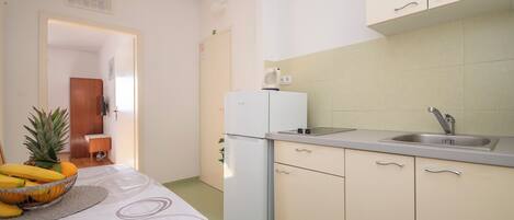 Fridge, coffee/tea maker, cookware/dishes/utensils