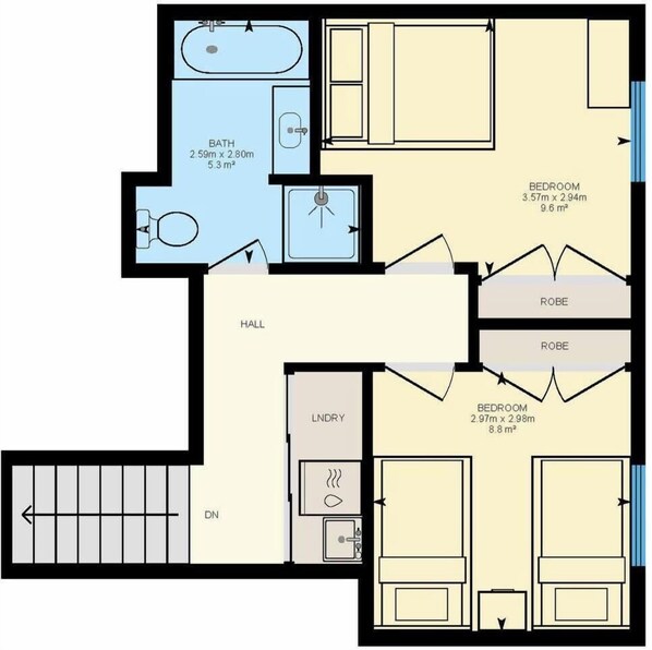 A floor plan with a bathroom, two bedrooms, a hall, a laundry area, and a dining area.