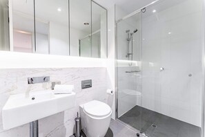 Shower, hair dryer, towels, shampoo