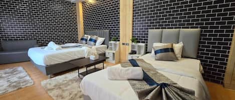 Family Triple Room | Memory foam beds, minibar, in-room safe, desk