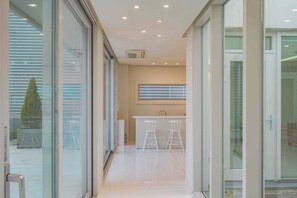 Villa, Ocean View, Beachside | Living area | 100-inch Smart TV with cable channels, Netflix, streaming services