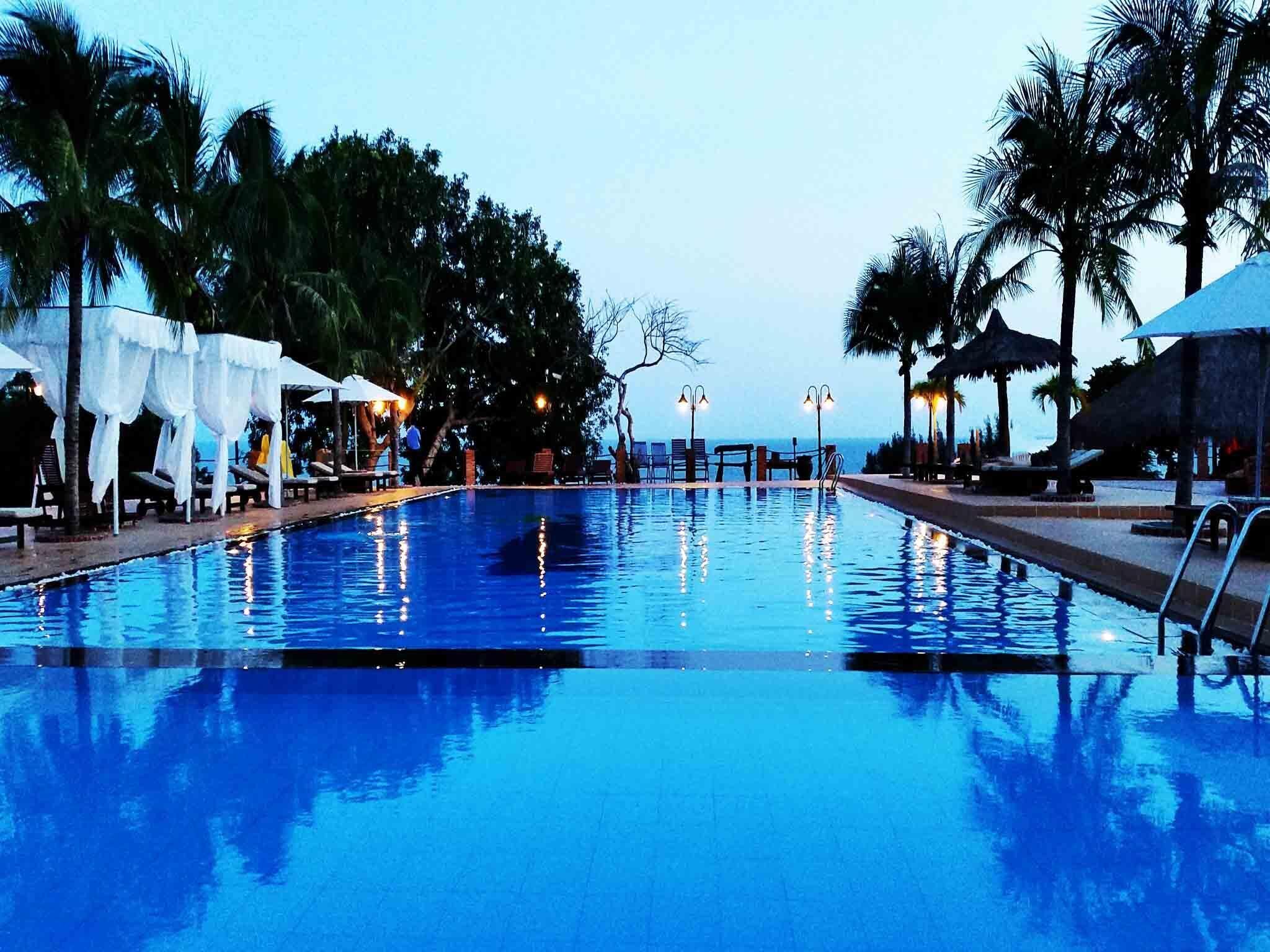 Outdoor pool, open 6:00 AM to 6:00 PM, free cabanas, pool umbrellas