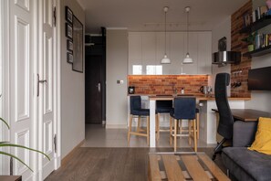 Apartment, Balcony, River View | In-room dining