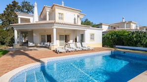 A two-story villa with a swimming pool, outdoor seating, and a garden. - Casa Oliveiras, villa with private pool & garden (Alvor)