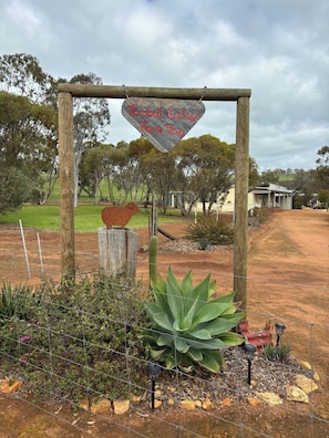 Experience the charm of Tambalil Cottage Farm Stay, surrounded by a well-maintained garden and a peaceful natural ambiance.