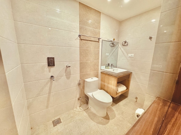 A modern bathroom with a shower, toilet, and vanity. - Hotel Bayberry Kathmandu - Near Tribhuvan International Airport (Kathmandu)