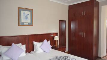 Deluxe Quadruple Room | Iron/ironing board, free WiFi, bed sheets