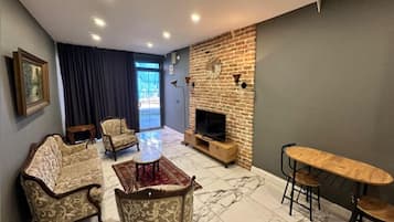 Superior Suite Annex Building | Living area | 50-inch LCD TV with satellite channels